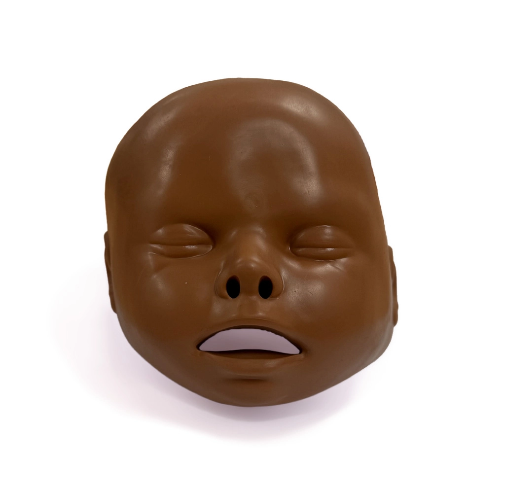 Brown infant CPR training manikin head with closed eyes, open mouth and nostrils, shown from the front on a white background.