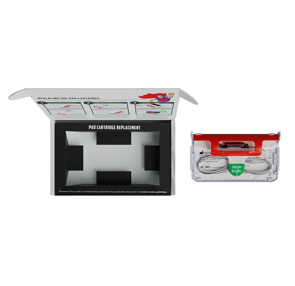Open packaging showing the HeartHero Elliot AED pad cartridge alongside the internal insert tray, highlighting how the cartridge is stored and presented for easy access.