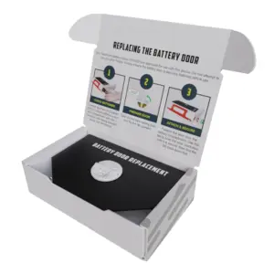 Open box view of the HeartHero battery door replacement kit, clearly showing the component inside alongside the printed installation guide.