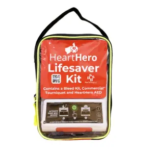 A front view of the HeartHero Lifesaver Kit bag, showing the AED and printed label through the transparent panel.